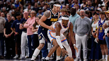 May 11, 2025; Denver, Colorado, USA; Oklahoma City Thunder guard Shai Gilgeous-Alexander (2) controls the ball under pressure from Denver Nuggets forward Aaron Gordon (32) in the fourth quarter during game four of the second round of the 2025 NBA Playoffs at Ball Arena. Mandatory Credit: Isaiah J. Downing-Imagn Images