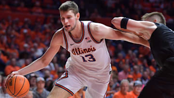 Feb 15, 2025; Champaign, Illinois, USA;  Illinois Fighting Illini center Tomislav Ivisic (13) drives around Michigan State Spartans forward Jaxon Kohler (0) during the first half at State Farm Center. Mandatory Credit: Ron Johnson-Imagn Images