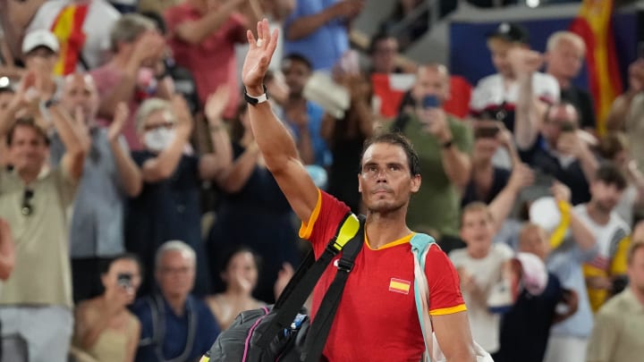 Rafael Nadal (ESP) waves to the crowd at the Paris 2024 Olympic Summer Games at Stade Roland Garros. 