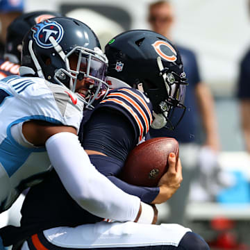 Sep 8, 2024; Chicago, Illinois, USA; Tennessee Titans linebacker Harold Landry III (58) sacks Chicago Bears quarterback Caleb Williams (18) during the second quarter at Soldier Field. Mandatory Credit: Mike Dinovo-Imagn Images