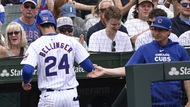 Jun 15, 2024; Chicago, Illinois, USA;  Chicago Cubs outfielder Cody Bellinger (24) high fives  manager Craig Counsell (30) after he scores against the St. Louis Cardinals during the fourth inning at Wrigley Field. Mandatory Credit: Matt Marton-USA TODAY Sports