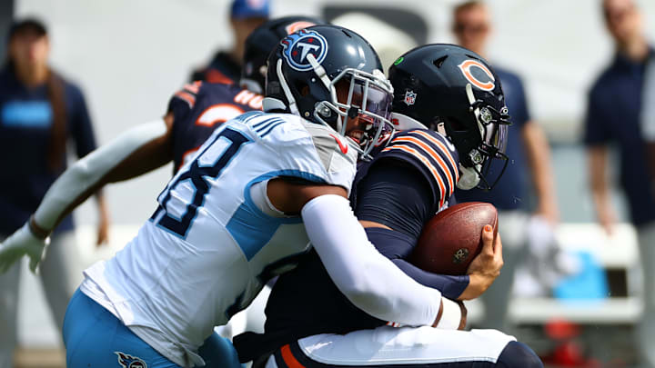 Sep 8, 2024; Chicago, Illinois, USA; Tennessee Titans linebacker Harold Landry III (58) sacks Chicago Bears quarterback Caleb Williams (18) during the second quarter at Soldier Field. Mandatory Credit: Mike Dinovo-Imagn Images