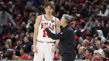 Oct 12, 2024; Chicago, Illinois, USA; Chicago Bulls head coach Billy Donovan talks with Chicago Bulls forward Matas Buzelis (14) during the first half at United Center. Mandatory Credit: David Banks-Imagn Images