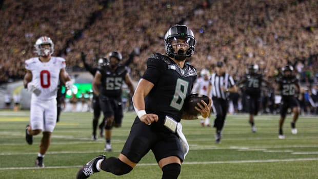 Oregon quarterback Dillon Gabriel scores a touchdown against Ohio State during the fourth quarter at Autzen Stadium Saturday,
