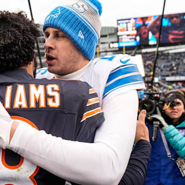 Jared Goff gives Caleb Williams a hug after Detroit's 34-17 win at Soldier Field last season.