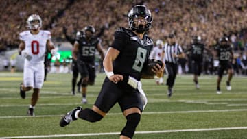 Oregon quarterback Dillon Gabriel scores in the fourth quarter of the Ducks' 32-31 victory over Ohio State on Oct. 12. If Ohio State wins out, the Big Ten Championship Game will be a Buckeyes-Ducks rematch.