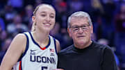 Jan 22, 2025; Storrs, Connecticut, USA; UConn Huskies guard Paige Bueckers (5) is recognized with head coach Geno Auriemma for her 2000 career points before the start of the game against the Villanova Wildcats at Harry A. Gampel Pavilion. Mandatory Credit: David Butler II-Imagn Images