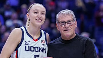 Jan 22, 2025; Storrs, Connecticut, USA; UConn Huskies guard Paige Bueckers (5) is recognized with head coach Geno Auriemma for her 2000 career points before the start of the game against the Villanova Wildcats at Harry A. Gampel Pavilion. Mandatory Credit: David Butler II-Imagn Images