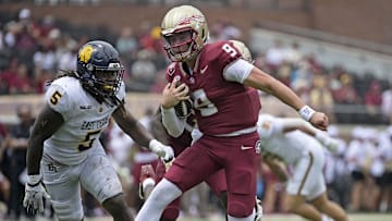 Sep 6, 2025; Tallahassee, Florida, USA; Florida State Seminoles quarterback Kevin Sperry (9) runs the ball against the East Texas A&M Lions during the second half at Doak S. Campbell Stadium. Mandatory Credit: Melina Myers-Imagn Images