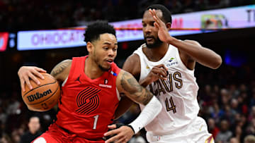 Mar 2, 2025; Cleveland, Ohio, USA; Portland Trail Blazers guard Anfernee Simons (1) drives to the basket against Cleveland Cavaliers forward Evan Mobley (4) during the second half at Rocket Arena. Mandatory Credit: Ken Blaze-Imagn Images