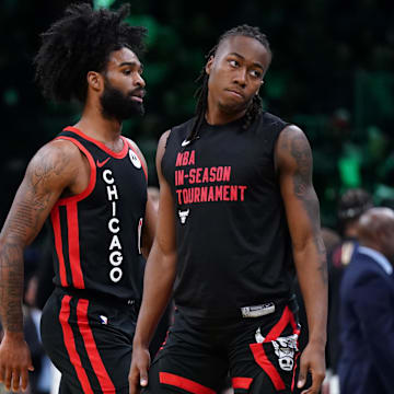 Nov 28, 2023; Boston, Massachusetts, USA; Chicago Bulls guard Ayo Dosunmu (12) and guard Coby White (0) return to the bench during a break in the action against the Boston Celtics in the second half at TD Garden. Mandatory Credit: David Butler II-Imagn Images