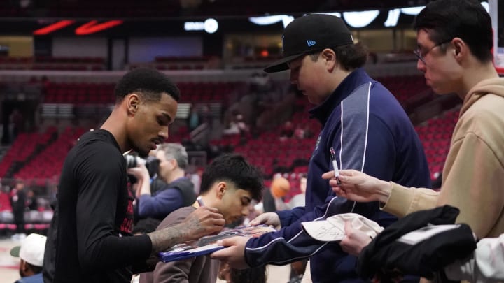 Apr 17, 2024; Chicago, Illinois, USA; Atlanta Hawks guard Dejounte Murray (5) signs autographs before a play-in game of the 2024 NBA playoffs against the Chicago Bulls at United Center. 