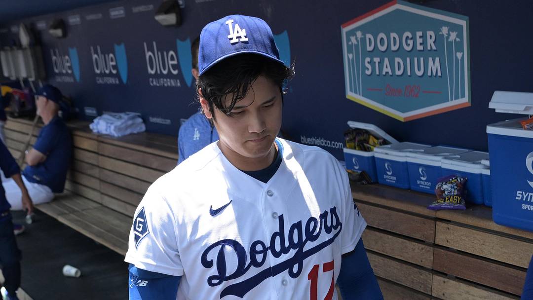 Dodgers starting pitcher Shohei Ohtani (17) walks through the dugout following the second inning against the Tampa Bay Rays at Dodger Stadium. 