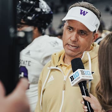 Jedd Fisch does a postgame interview following a season-opening win over Weber State. 