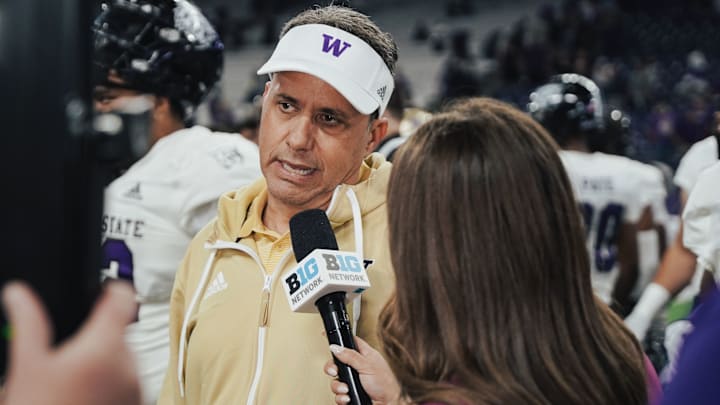 Jedd Fisch does a postgame interview following a season-opening win over Weber State. 