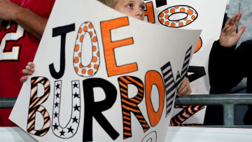 A young Cincinnati Bengals fan holds a Joe Burrow sign in the fourth quarter during a Week 15 NFL