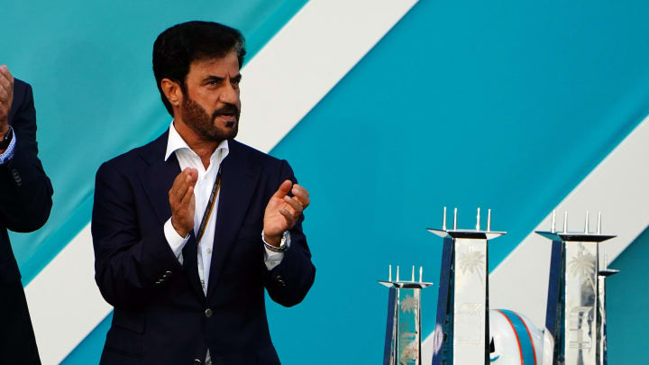 May 8, 2022; Miami Gardens, Florida, USA; Dan Marino and FIA president Mohammed Ben Sulayem applaud during the award ceremony following the Miami Grand Prix at Miami International Autodrome. Mandatory Credit: John David Mercer-USA TODAY Sports