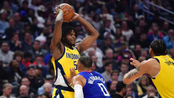 Mar 25, 2024; Los Angeles, California, USA; Indiana Pacers forward Jarace Walker (5) controls the ball against Los Angeles Clippers guard Russell Westbrook (0) during the first half at Crypto.com Arena. Mandatory Credit: Gary A. Vasquez-USA TODAY Sports