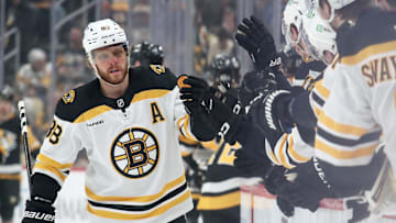 Mar 1, 2025; Pittsburgh, Pennsylvania, USA;  Boston Bruins right wing David Pastrnak (88) celebrates with the Bruins bench after scoring a goal against the Pittsburgh Penguins during the first period at PPG Paints Arena. Mandatory Credit: Charles LeClaire-Imagn Images