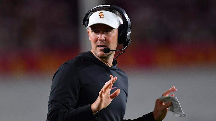Oct 7, 2023; Los Angeles, California, USA; Southern California Trojans head coach Lincoln Riley watches game action against the Arizona Wildcats during the first half at Los Angeles Memorial Coliseum. Mandatory Credit: Gary A. Vasquez-Imagn Images Oct 7, 2023; Los Angeles, California, USA; Southern California Trojans head coach Lincoln Riley watches game action against the Arizona Wildcats during the first half at Los Angeles Memorial Coliseum. Mandatory Credit: Gary A. Vasquez-Imagn Images