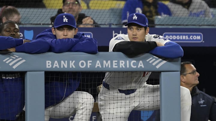 Apr 16, 2025; Los Angeles, California, USA; Los Angeles Dodgers starting pitcher Roki Sasaki (11) and designated hitter Shohei Ohtani (17) watch from the dugout during the ninth inning against the Colorado Rockies at Dodger Stadium. Mandatory Credit: Jayne Kamin-Oncea-Imagn Images Apr 16, 2025; Los Angeles, California, USA; Los Angeles Dodgers starting pitcher Roki Sasaki (11) and designated hitter Shohei Ohtani (17) watch from the dugout during the ninth inning against the Colorado Rockies at Dodger Stadium. Mandatory Credit: Jayne Kamin-Oncea-Imagn Images