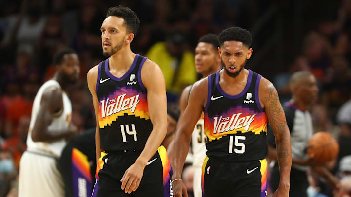 Oct 20, 2021; Phoenix, Arizona, USA; Phoenix Suns guard Landry Shamet (14) and guard Cameron Payne (15) against the Denver Nuggets at Footprint Center. Mandatory Credit: Mark J. Rebilas-Imagn Images