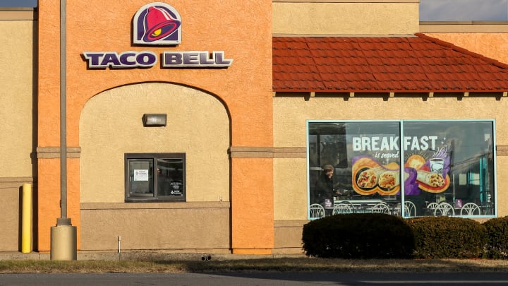 View of a Taco Bell restaurant sign and logo...