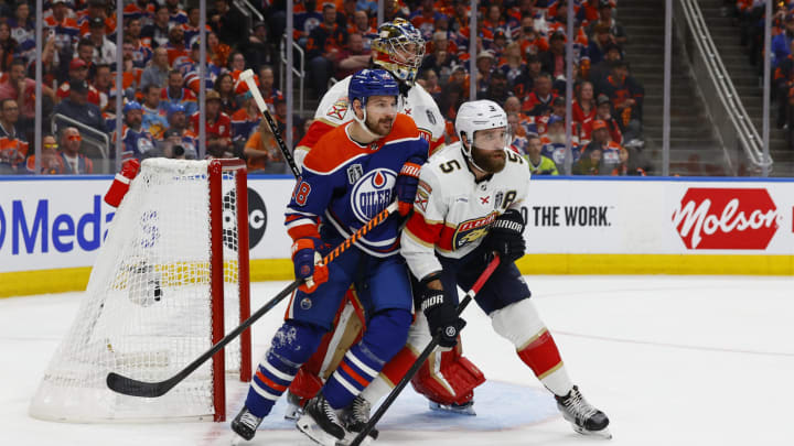 Jun 15, 2024; Edmonton, Alberta, CAN;Edmonton Oilers left wing Zach Hyman (18) skates against Florida Panthers defenseman Aaron Ekblad (5) in the second period in game four of the 2024 Stanley Cup Final at Rogers Place. Mandatory Credit: Perry Nelson-USA TODAY Sports