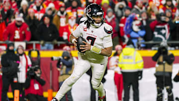 Jan 18, 2025; Kansas City, Missouri, USA; Houston Texans quarterback C.J. Stroud (7) rolls out to pass during the second half against the Kansas City Chiefs in a 2025 AFC divisional round game at GEHA Field at Arrowhead Stadium. Mandatory Credit: Jay Biggerstaff-Imagn Images