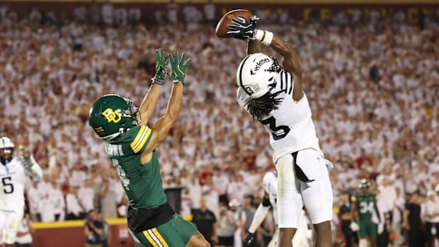 Iowa State defensive back Jontez Williams (3) intercepts a pass intended for Baylor wide receiver Monaray Baldwin.