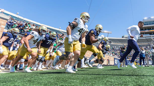 Marcus Freeman leads Notre Dame onto the field for the 2025 Spring football gam