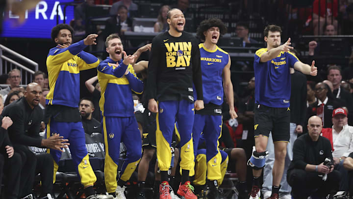 May 4, 2025; Houston, Texas, USA; Golden State Warriors bench players celebrate after a basket by guard Buddy Hield (not pictured) during the second quarter of game seven of the first round for the 2025 NBA Playoffs against the Houston Rockets  at Toyota Center. Mandatory Credit: Troy Taormina-Imagn Images