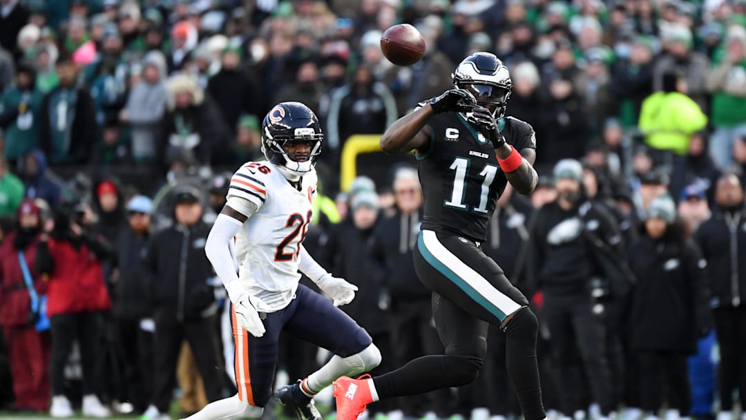 Nov 28, 2025; Philadelphia, Pennsylvania, USA; Philadelphia Eagles wide receiver A.J. Brown (11) makes a reception defended by Chicago Bears cornerback Nahshon Wright (26) during the second quarter of the game at Lincoln Financial Field. Mandatory Credit: Eric Hartline-Imagn Images