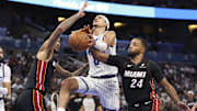 Oct 22, 2025; Orlando, Florida, USA; Miami Heat guard Norman Powell (24) strips the ball from Orlando Magic guard Anthony Black (0) in the fourth quarter at Kia Center. Mandatory Credit: Nathan Ray Seebeck-Imagn Images