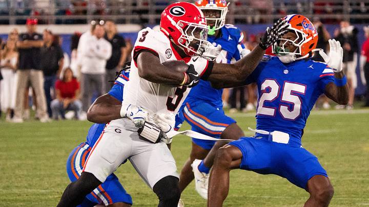 Georgia running back Nate Frazier (3) pushes off Florida Gators defensive back Cormani McClain (25) in the second half in an NCAA football game, Saturday, Nov. 1, 2025, at EverBank Stadium in Jacksonville, Fla. Georgia defeated Florida 24-20.