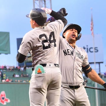Jun 14, 2024; Boston, Massachusetts, USA; New York Yankees right fielder Alex Verdugo (24) celebrates his two-run home run against the Boston Red Sox with left fielder Juan Soto (22) during the first inning at Fenway Park. 
