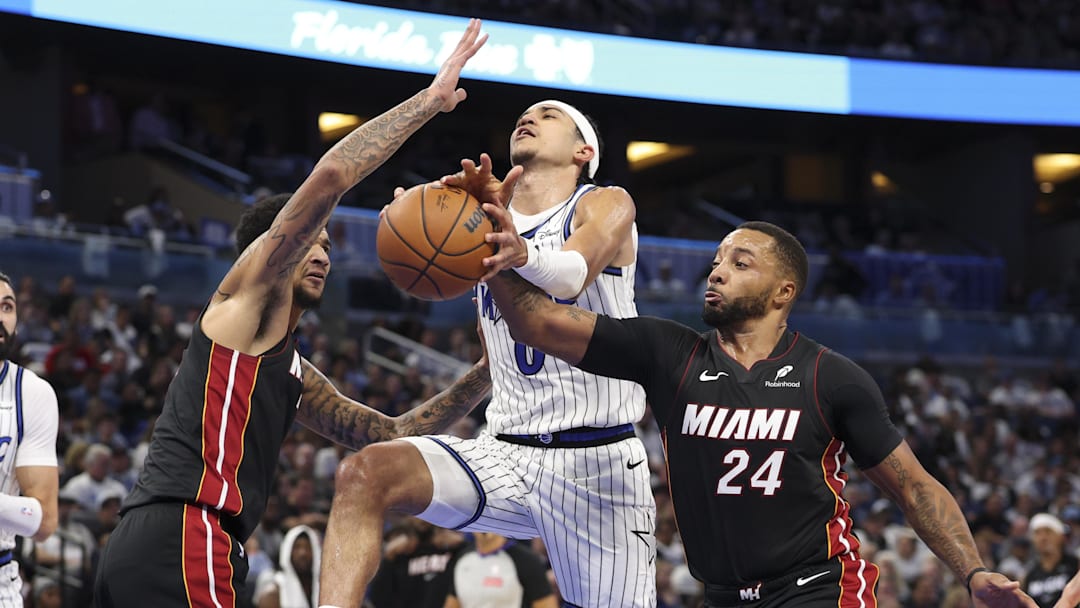 Oct 22, 2025; Orlando, Florida, USA; Miami Heat guard Norman Powell (24) strips the ball from Orlando Magic guard Anthony Black (0) in the fourth quarter at Kia Center. Mandatory Credit: Nathan Ray Seebeck-Imagn Images Oct 22, 2025; Orlando, Florida, USA; Miami Heat guard Norman Powell (24) strips the ball from Orlando Magic guard Anthony Black (0) in the fourth quarter at Kia Center. Mandatory Credit: Nathan Ray Seebeck-Imagn Images