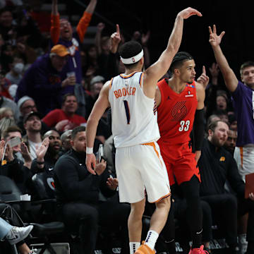 Feb 3, 2025; Portland, Oregon, USA;  Phoenix Suns guard Devin Booker (1) reacts after scoring against the Portland Trail Blazers to make Booker the Suns’ all-time leading scorer in the second half at Moda Center. Mandatory Credit: Jaime Valdez-Imagn Images