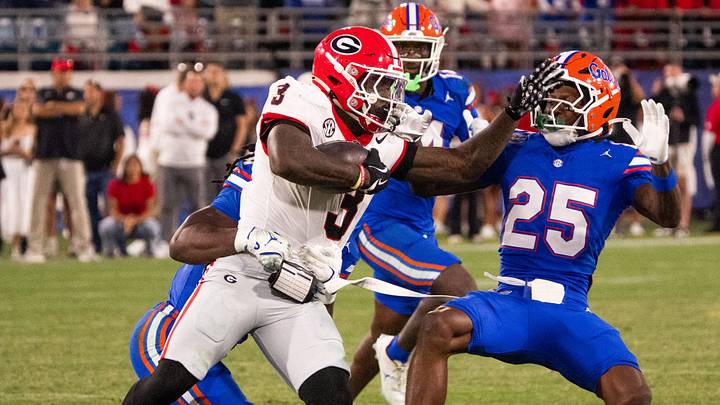 Georgia Bulldogs running back Nate Frazier (3) pushes off Florida Gators defensive back Cormani McClain (25) in the second half in an NCAA football game, Saturday, Nov. 1, 2025, at EverBank Stadium in Jacksonville, Fla. Georgia defeated Florida 24-20. [Doug Engle/Florida Times-Union]