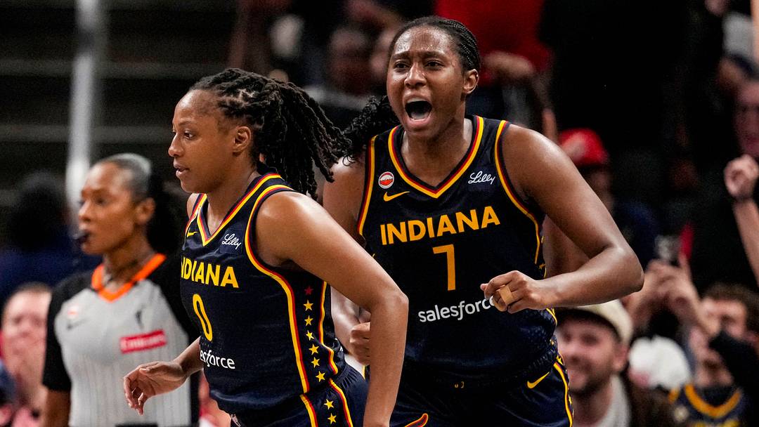Indiana Fever center Aliyah Boston (7) yells in excitement after Indiana Fever guard Kelsey Mitchell (0) scores a three-point basket on Tuesday, Sept. 22, 2026, during the game at Gainbridge Fieldhouse in Indianapolis.