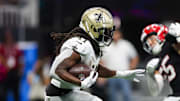 Sep 29, 2024; Atlanta, Georgia, USA; New Orleans Saints running back Alvin Kamara (41) runs the ball against the Atlanta Falcons in the second quarter at Mercedes-Benz Stadium. Mandatory Credit: Brett Davis-Imagn Images