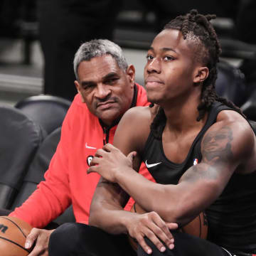 Feb 9, 2023; Brooklyn, New York, USA;  Chicago Bulls assistant coach Maurice Cheeks (l) and guard Ayo Dosunmu (12) talk during warmups prior to the game against the Brooklyn Nets at Barclays Center. Mandatory Credit: Wendell Cruz-USA TODAY Sports