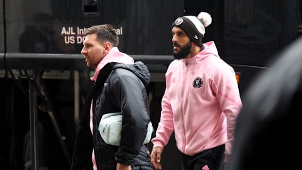 Lionel Messi and his bodyguard Yassine Chueko.