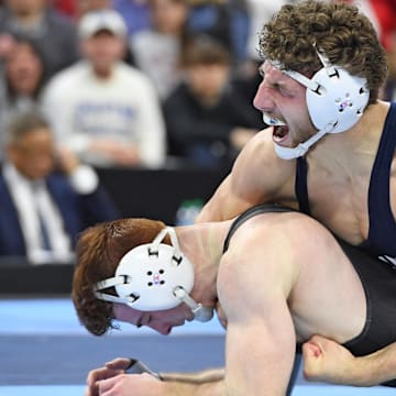 Mitchell Mesenbrink of the Penn State Nittany Lions celebrates his win vs. Michael Caliendo of the Iowa Hawkeyes during the 2025 NCAA Wrestling Championships. 