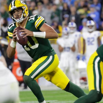 Green Bay Packers quarterback Jordan Love (10) moves out of the pocket to throw a two point conversion pass against the Detroit Lions during their football game Thursday, September 28, 2023, at Lambeau Field in Green Bay, Wis.