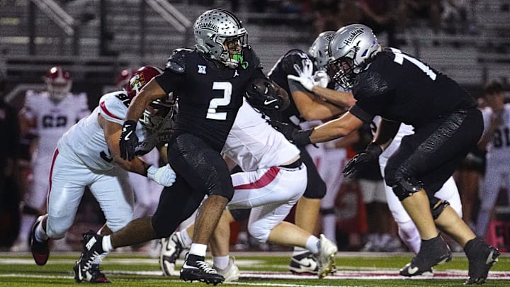 Hamilton running back Jacob Brown (2) rushes against Brophy during a game at Hamilton High School in Chandler, on Sept. 19, 2025.