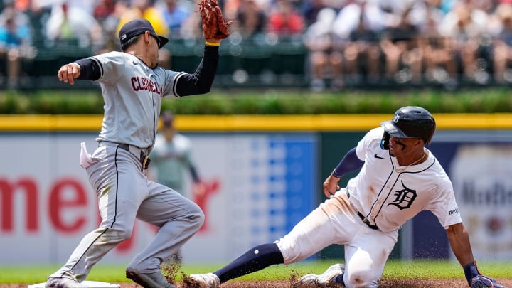 Detroit Tigers right fielder Wenceel Pérez (46) slides into second base against Cleveland Guardians second base Andrés Giménez (0) during the first inning at Comerica Park in Detroit on Thursday, July 11, 2024.