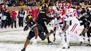 Nov 30, 2024; Columbia, Missouri, USA; Missouri Tigers running back Marcus Carroll (9) scores a touchdown against the Arkansas Razorbacks during the second half at Faurot Field at Memorial Stadium. Mandatory Credit: Denny Medley-Imagn Images