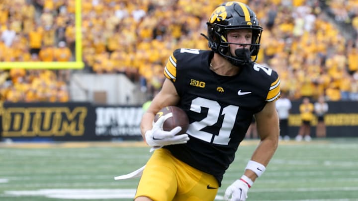 Iowa’s Kaden Wetjen (21) runs with the ball against Troy Saturday, Sept. 14, 2024 at Kinnick Stadium in Iowa City, Iowa.