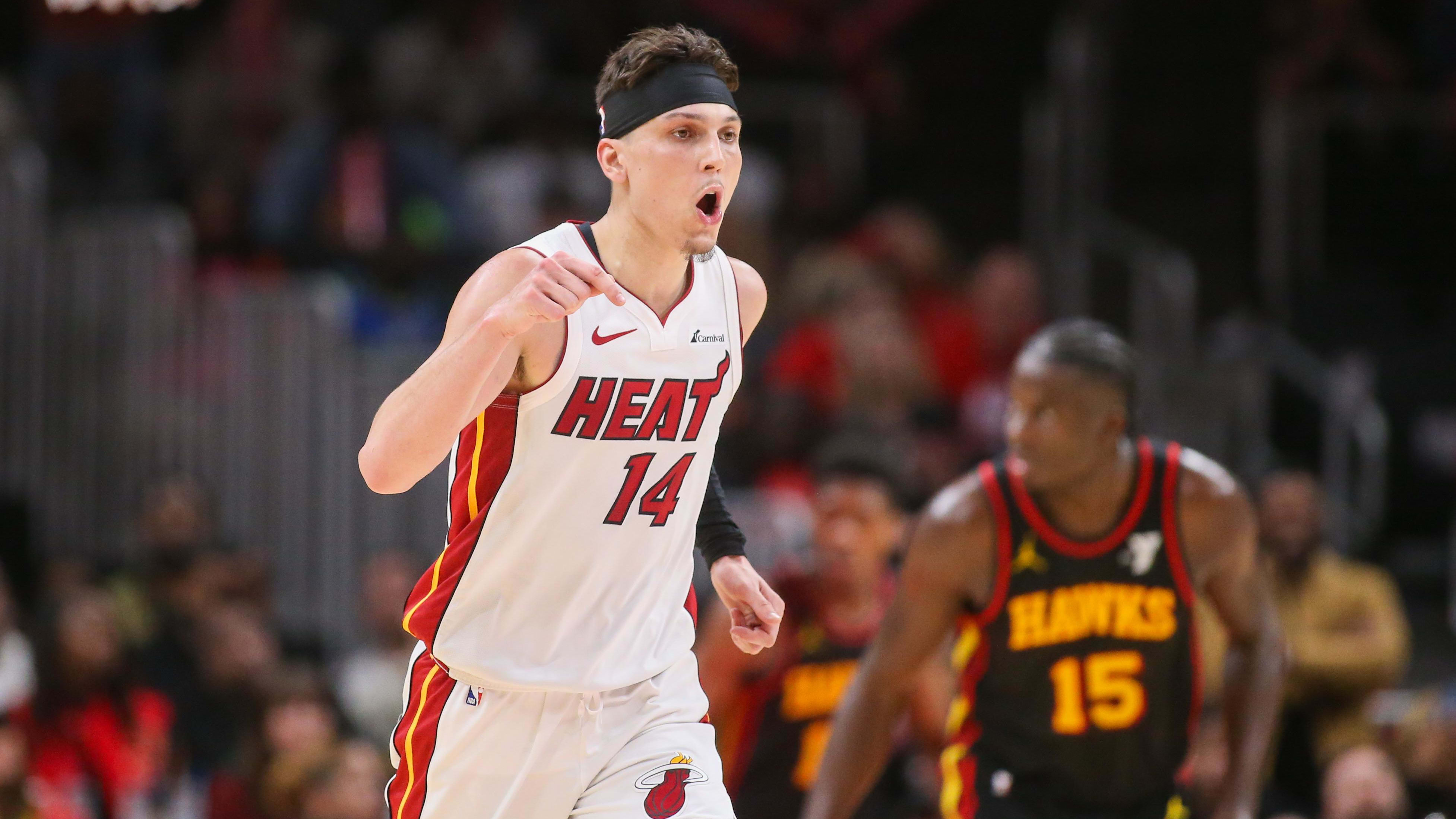 Apr 9, 2024; Atlanta, Georgia, USA; Miami Heat guard Tyler Herro (14) reacts after a basket against